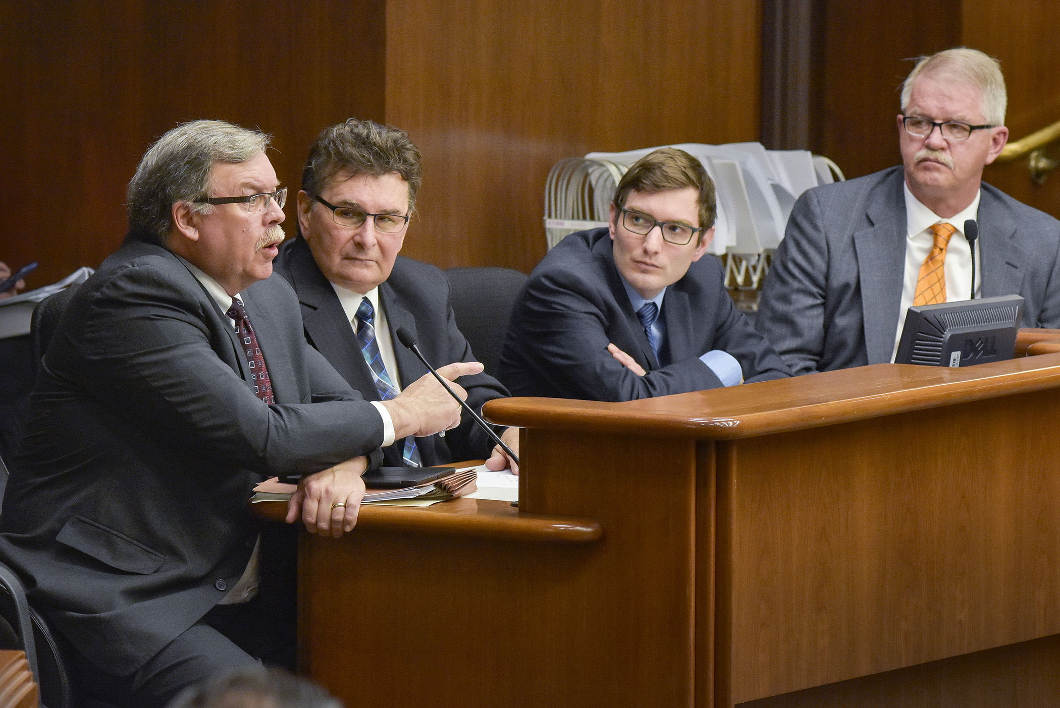 Mark Phillips, commissioner of the Iron Range Resources and Rehabilitation Board, from left, Rep. Tom Anzelc, Rep. Jason Metsa and Rep. Rob Ecklund testify before the House Government Operations and Elections Policy Committee April 20 during discussion of a bill that would, among other things, abolish the IRRRB and create a new commission. Photo by Andrew VonBank